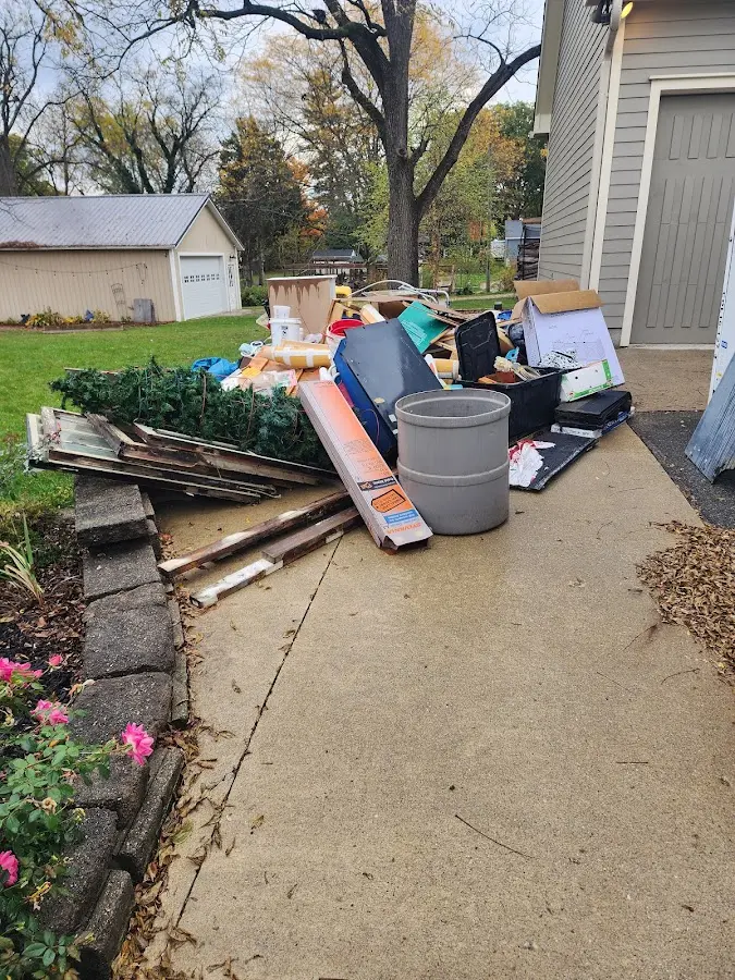 Dumpster being loaded with debris for Estate Cleanout Dumpster Rental in Broadview Heights